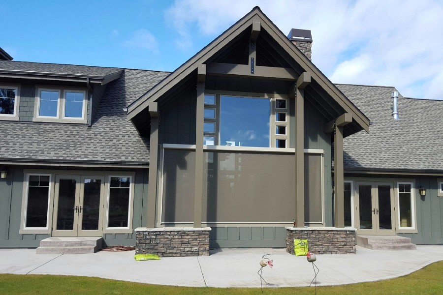 Large Expansive Exterior Shade Protecting Bank of Living Room Windows