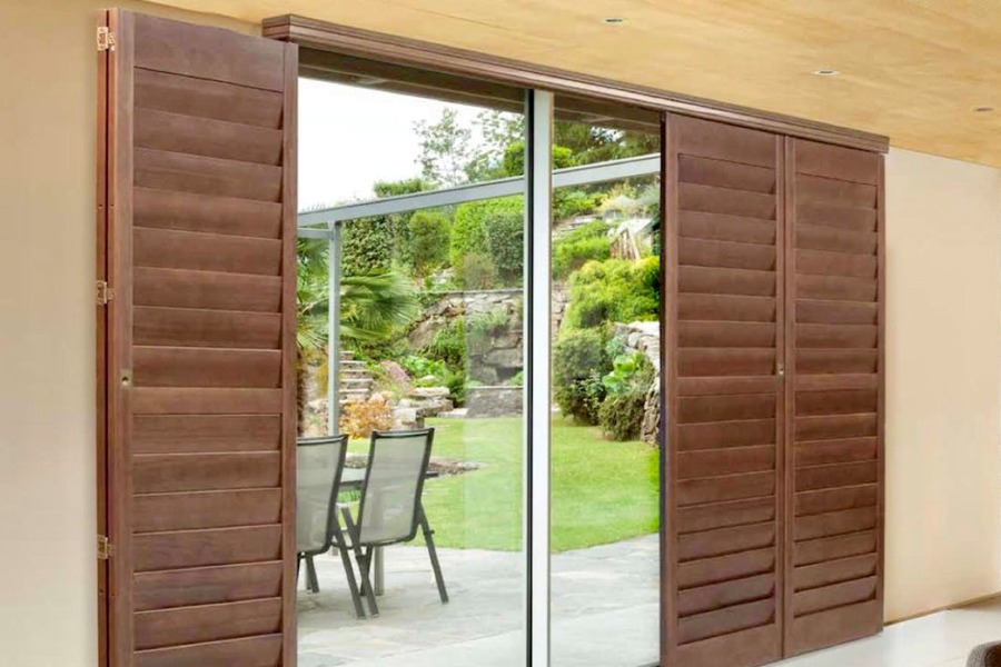 Bi-Fold Shutters over Sliding Door